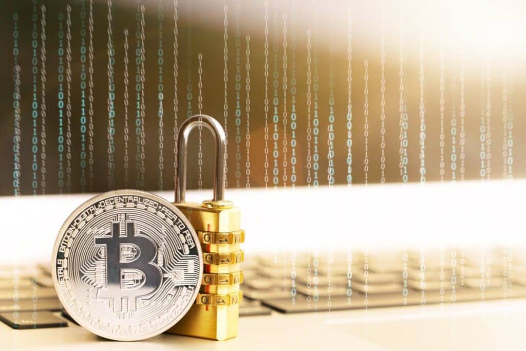 Bitcoin next to a lock and 0s and 1s in the background to show the security of holding your private keys when investing in cryptocurrency.