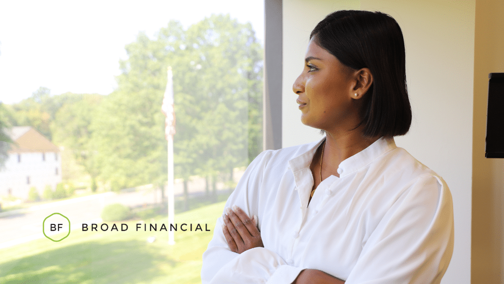broad financial employee looking out the window